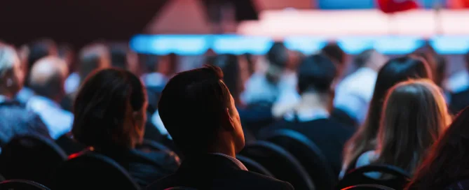 speaker-stage-with-rear-view-audience-conference-hall-edtech-events-concept