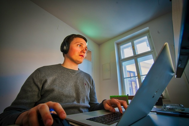 Product development trends also influenced talent acquisition; in the image, we see man using MacBook and cordless headphones