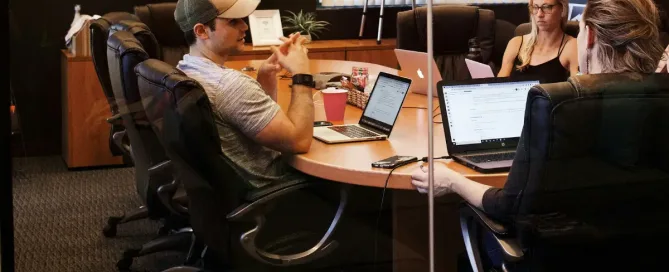 High-Performing FinTech Software Team: 3 people share a meeting room
