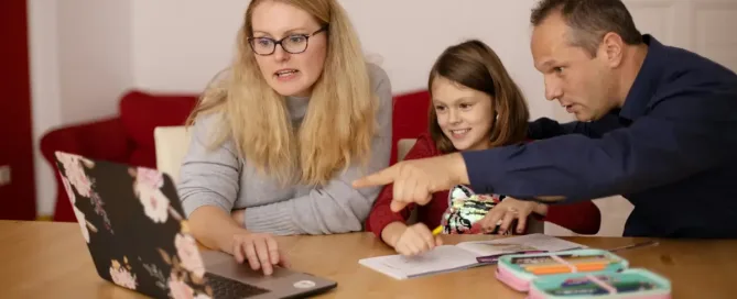 ai impact on educators and parents: woman in gray long sleeve shirt sitting beside boy in blue sweater Parents learning teaching their child during homeschooling.