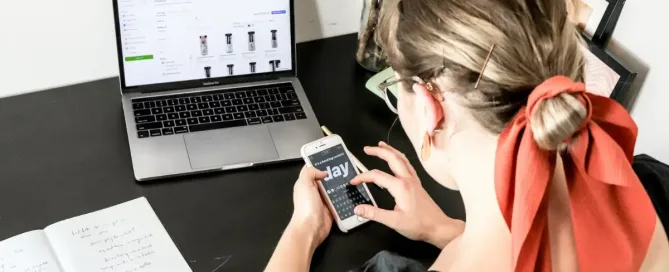 ecommerce platform: digital marketing, woman in orange shirt using iphone