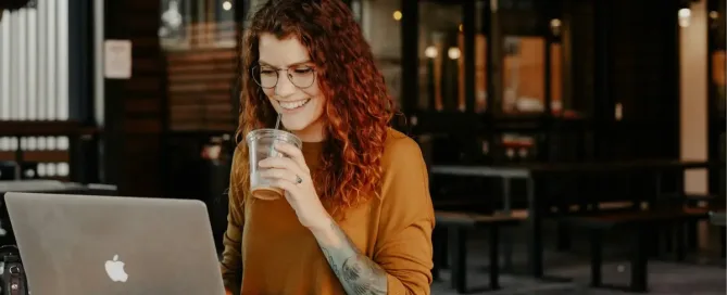 APIs for Microservices: woman in brown long sleeve shirt sitting by the table using macbook
