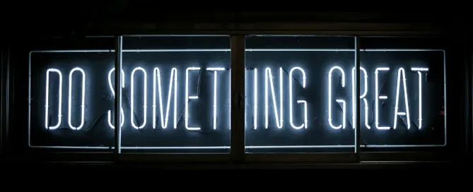 Neon sign reading "Do something great". Unlocking the power of edge and cloud computing together.