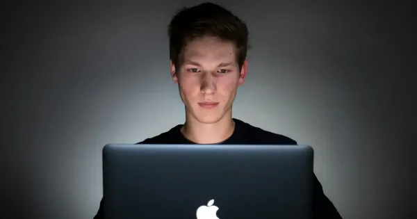 service discovery: young man using laptop