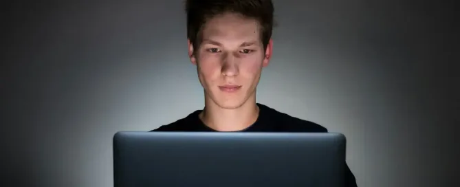 service discovery: young man using laptop