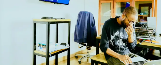 Containerization Tools: man using silver MacBook while sitting