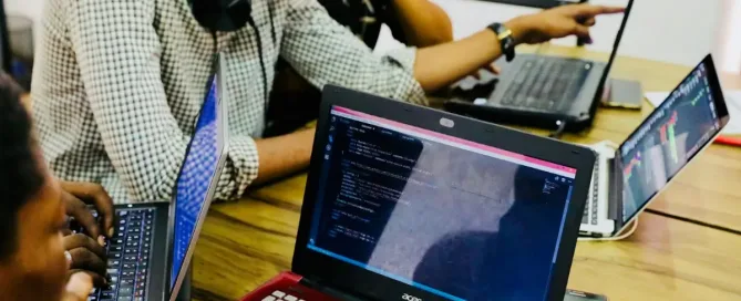 cloud platforms: person using black and red Acer laptop computer on table