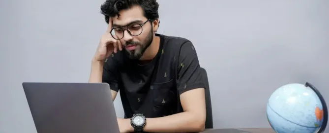 code mistakes: a frustrated a man sitting in front of a laptop computer