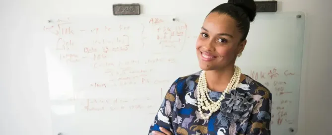 customer centric product: woman in blue and gray long-sleeved shirt wearing gold-colored necklace