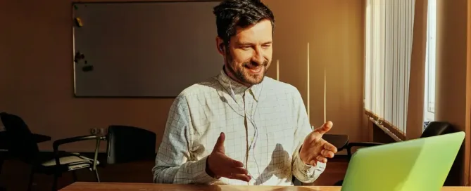 image data and visual data: smiling man facing laptop