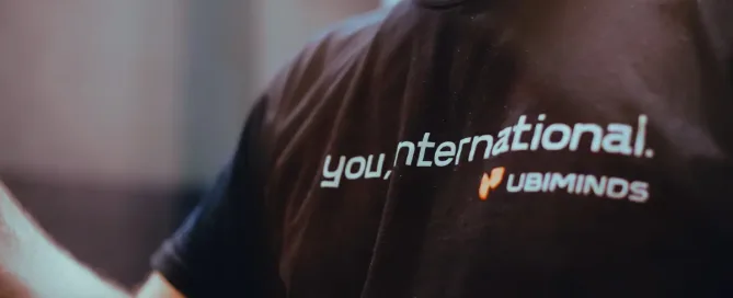 Nearshore solutions: we see a black t-shirt with white lettering that reads "You, international."