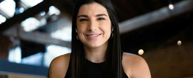 labor day in tech: smiling woman in black tank top: Portrait of the head of QA at my company