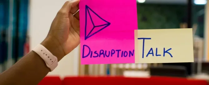 strategic disruption: person holding pink sticky notes