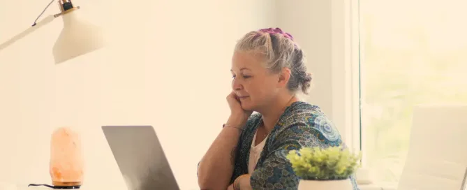 green coding practices: woman thoughtfully watching screen