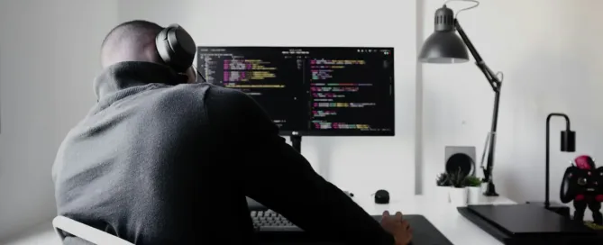 How Tech Pros Know It’s Time to Leave: man in black long sleeve shirt sitting on chair in front of computer