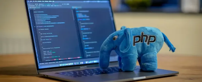 php developer: PHP Plush Elephant on a Macbook Pro, with PHP Storm running on it.