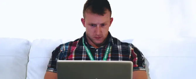 security tech stack: security engineer concentrates while looking at laptop screen