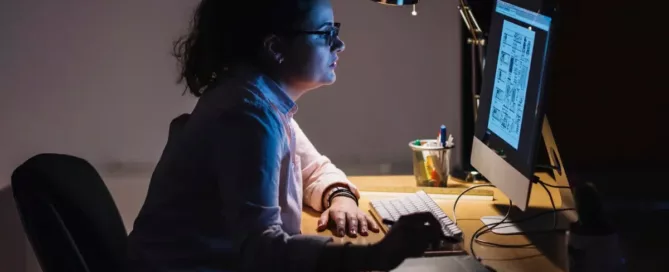 Accessibility Compliance: Software engineer working at night