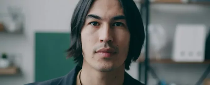 SRE Hiring portrait of confident Asian Reliability Engineer