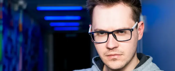 privacy engineer hiring: Portrait of hacker staring threateningly at camera