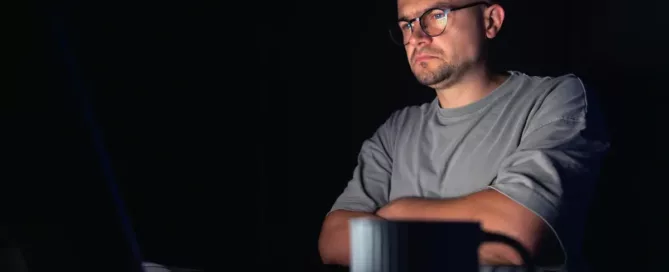 Manage Code Quality: backend engineer works at the computer at night