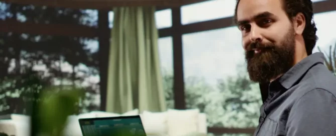 Output vs. Impact in Software Development: Relaxed rich man using laptop at luxury vacation home