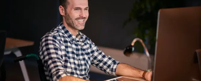 Quality Control in Staff Augmentation: Disabled man working with technology in home office