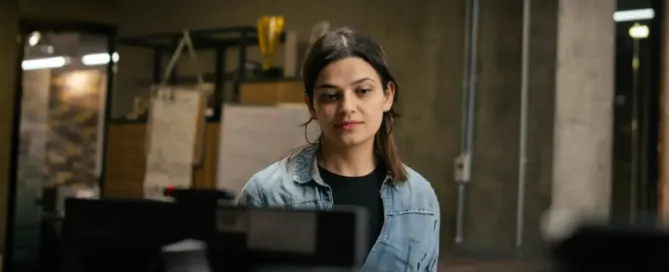 Reduce Attrition in Tech Teams: engineer looks longingly at computer