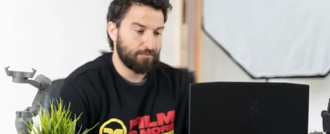 Retention-Focused Staffing: tired-looking engineer sitting at a desk with a laptop and a microphone
