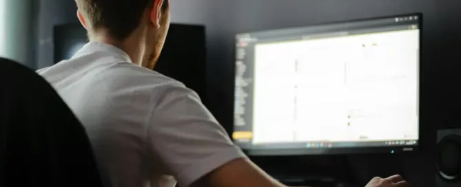 offshore hiring errors: software engineer sitting in front of a computer monitor