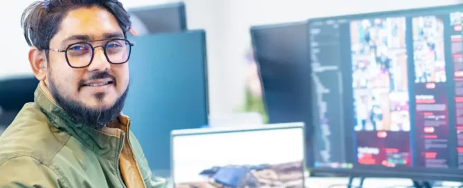 software team alignment: A man sitting in front of a computer monitor