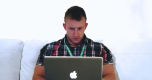 security tech stack: security engineer concentrates while looking at laptop screen